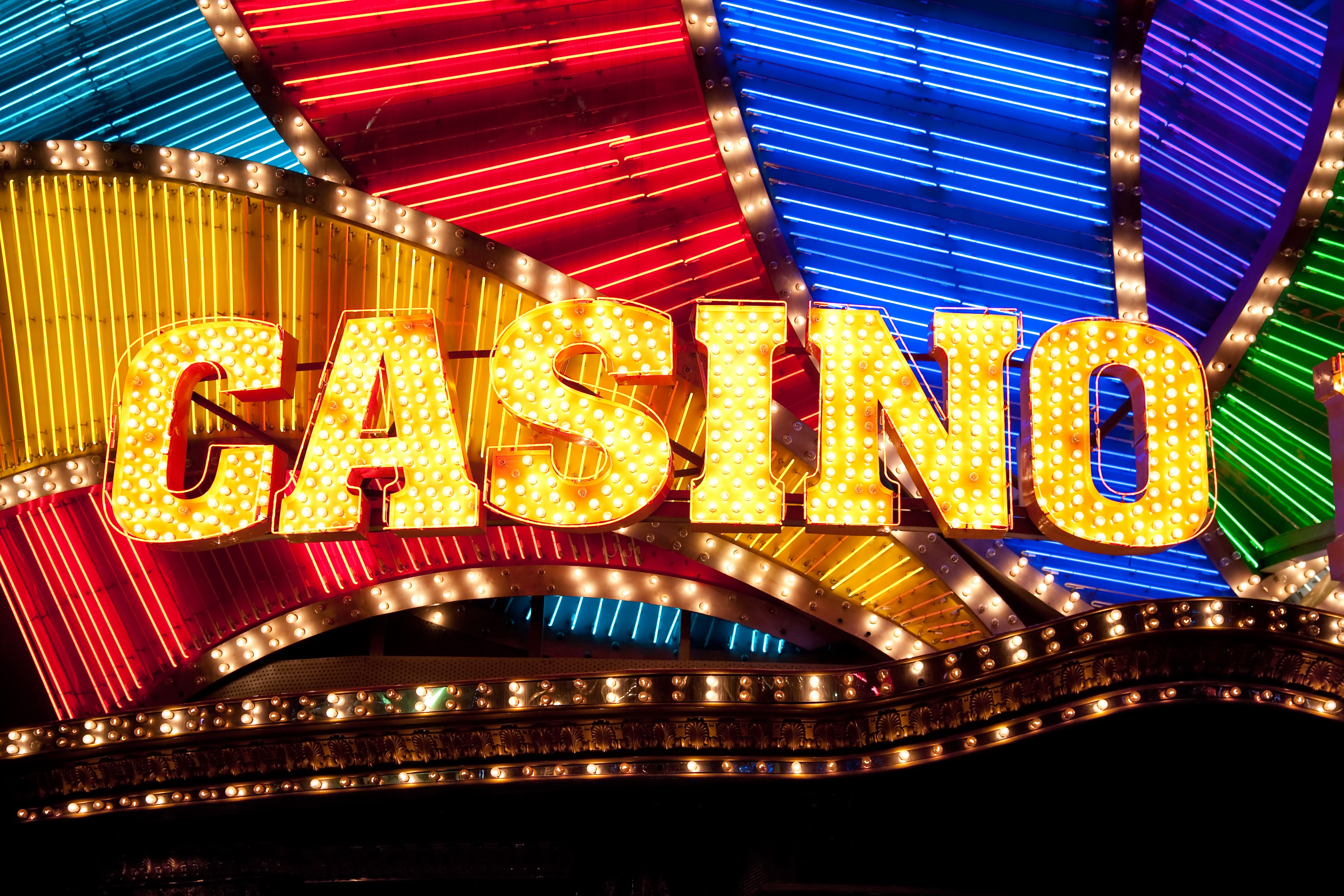 A vibrant graphic showcasing the Cash Club Casino logo and a cascade of gold coins.